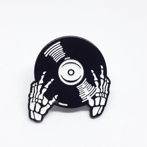 Skeleton hands vinyl record enamel pin